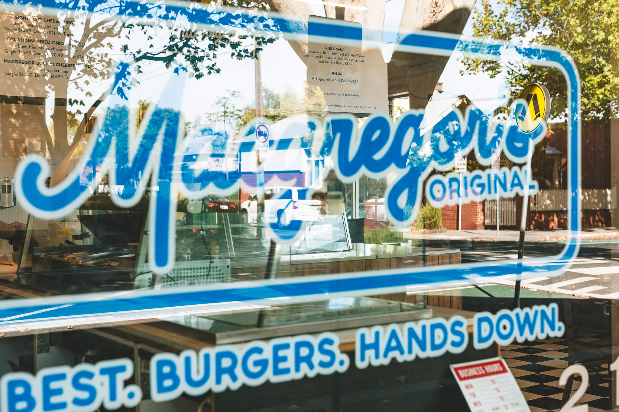 Macgregor's Original logo hand-painted on the shop window — 'Best. Burgers. Hands Down.'